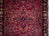A beautiful early 20th century Persian Sarouk runner with a large-scale mirrored floral pattern containing myriad floral...