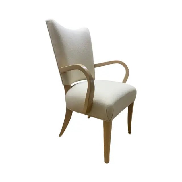 This is the Root Beer chair Attributed to Brueton. It is done in a cream white fabric with solid maple legs and arms. The...