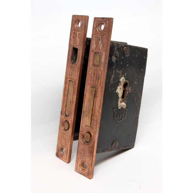 Pair of Aesthetic copper plated cast iron Corbin mortise locks for double pocket doors. Set includes a pair of locks and...