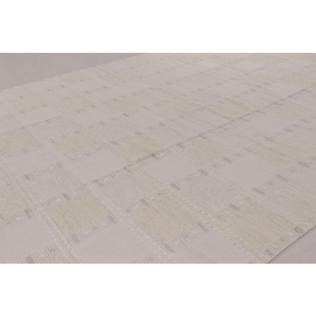 Handwoven in wool and undyed natural yarns, this 14x20 oversized flatweave is a premier selection from our contemporary...