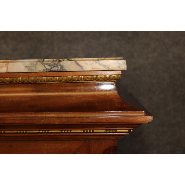 This magnificent Louis XVI style marquetry inlaid bookcase vitrine is an exceptional example of French-inspired...