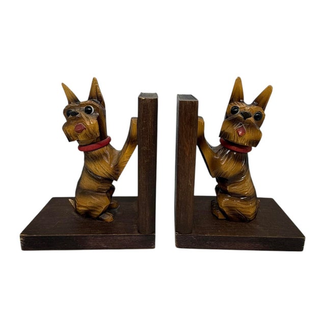 Discover playful elegance with these hand-carved wooden bookends from the mid-20th century. Featuring Scottish Terriers...
