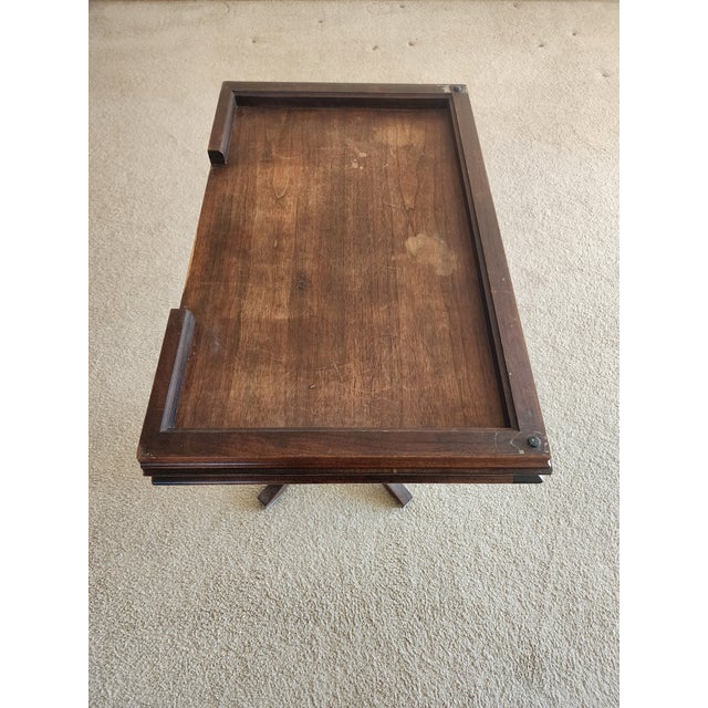 20th century. Pedestal flip-top side or game table with a swivel or movable base to the center. It's in very good...