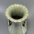 A vintage‑style Chinese Longquan celadon lobed vase, with flared flower‑shaped rim and two pierced ring‑shaped side...