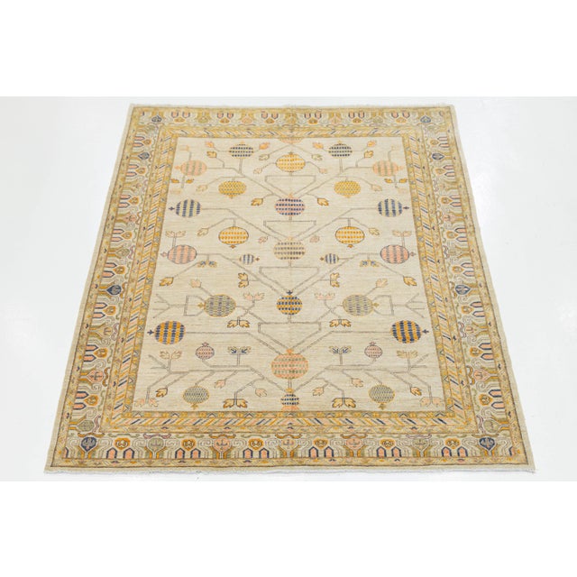 Elevate your interior with this stunning Modern Khotan style wool rug, inspired by Silk Road designs. Hand-knotted from...