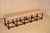 19th century long oak upholstered bench from France. The seat is newly upholstered in linen and is finished with single...