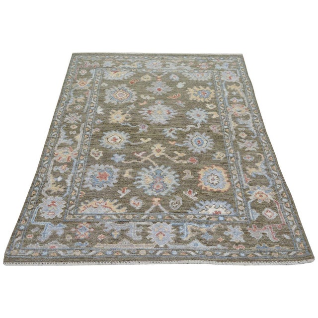 Hand-knotted with care using traditional rug-making techniques, this wool rug blends timeless craftsmanship with a modern...