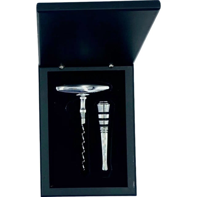 Details: -Vintage set comes with original box, stainless steel corkscrew, and stainless steel wine bottle stopper -Set is...