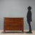 Walnut commode crafted in Italy at the end of the 18th century, featuring an elegant and functional design. The front has...