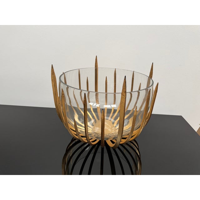 Dramatic large sunburst pattern bowl. Gilded metal with round glass bowl. Felt lined on the bottom.