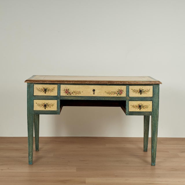 Charming vintage Italian desk crafted in wood in classic form with five drawers and elegant tapered legs, hand decorated...