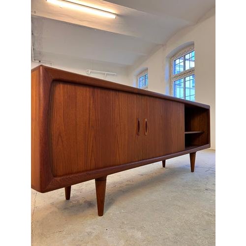 This sideboard by H.P. Hansen is an absolute gem of Danish furniture craftsmanship, embodying the artisanal perfection of...