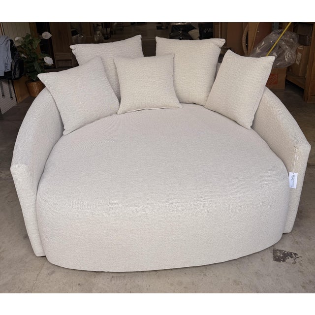 This stunning curved lounge sofa brings a sophisticated blend of contemporary and organic modern design to any space....