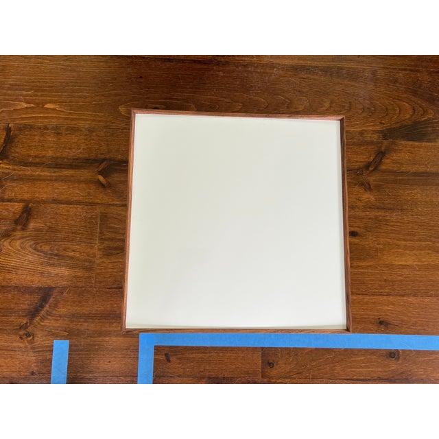 Modern Finn Juhl side table. Base is steel frame and the top is removable with black on one side and white on the other....