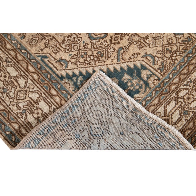 Beautiful hand-knotted wool, vintage medallion rug. This rug has a beige field with blue accents featuring an all over...