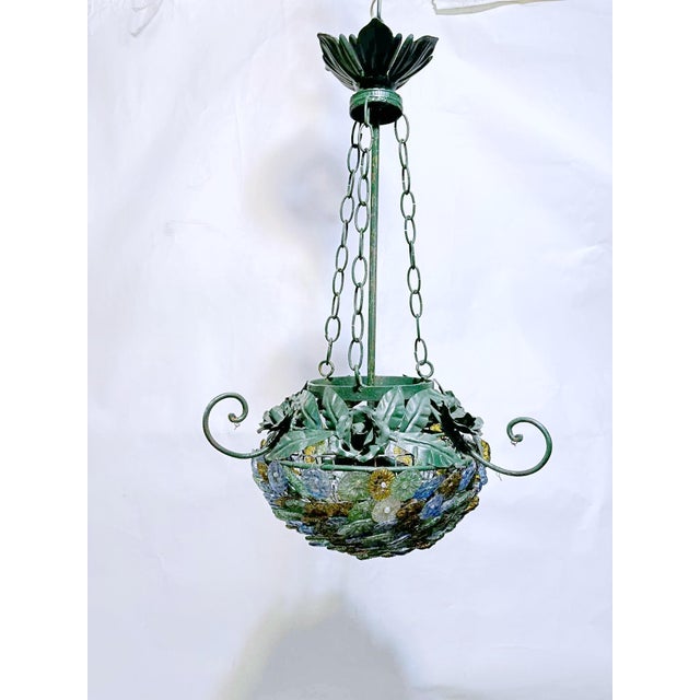 A very elegant neoclassical Chandelier composed of diecast and colorful Italian Murano Glass drops and flowers in many...