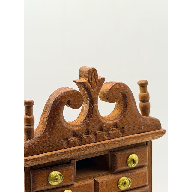 Charming vintage 1:12 scale miniature highboy chest produced by Shackman, featuring a traditional stacked form with a...