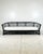 Vintage rattan Chinese chippendale sofa. Rounded frame with chippendale fretwork panels. Dark brown, almost black glossy...