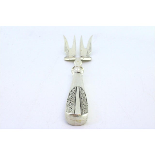 Silver Fish Serving Fork with Floral Motifs in Relief on the Handle, in Good conditions.