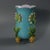 Minton Majolica vase which features flowers and leaves sprouting from bulb feet. Turquoise ground version. Colouration:...