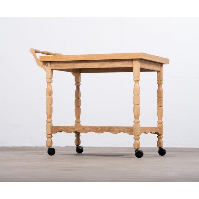 Charming Danish oak serving table from the 1960s, featuring a distinctive brutalist design and beautiful ceramic tiles....