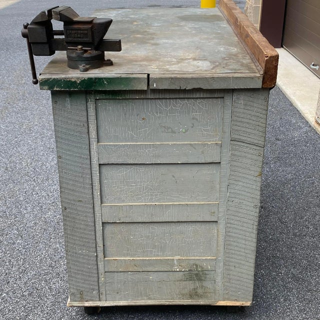 One of kind custom made work bench circa 1951 featuring a galvanized top over wood and a Craftsman vise. Beautiful patina...
