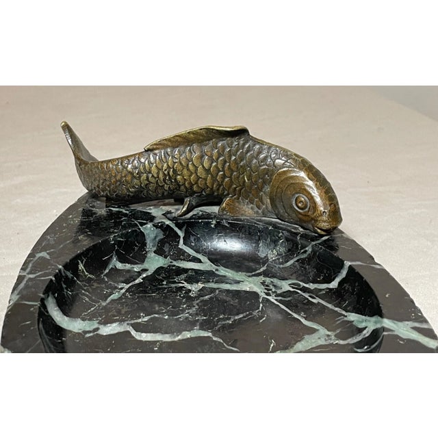 This antique Japanese bronze and marble figural Japanese coy fish ashtray is a unique addition to any collection. The...