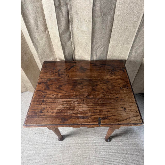 This fine English lowboy dates to the mid-18th century and reflects the understated elegance of provincial Georgian...