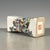This is an elegant vintage porcelain pillow (瓷枕), also known as a wrist rest (脉枕) or paperweight (镇尺), a traditional...