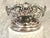 An exquisite pair of antique English, fully hallmarked, sterling silver wine coasters, each with pierced foliate sides, an...