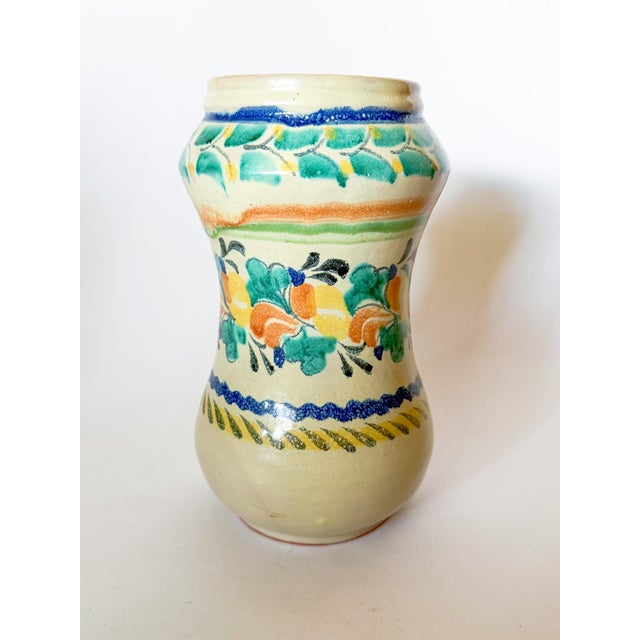 Lovely hourglass Talavera vase made by artisan Gorky Gonzalez in Mexico. His iconic designs and glazes are fluid and...