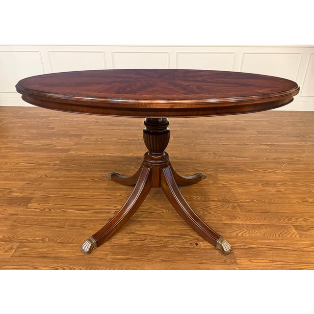 This is multi-use oval mahogany table made to order in the Leighton Hall shop in Suwanee, Georgia. It features a field of...