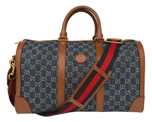 Gucci Denim Gg Supreme Canvas and Brown Leather Duffle Bag, Spring/Summer 2022.