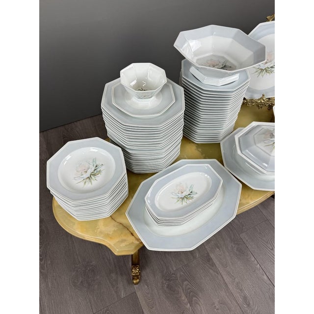 An elegant and refined Limoges porcelain dinner service from the Ancienne Manufacture Royale, founded in 1737. This superb...