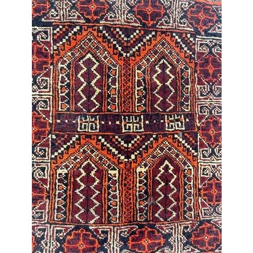 Pretty vintage small Turkmen Baluch rug with beautiful tribal design and nice colours, entirely hand knotted with wool on...