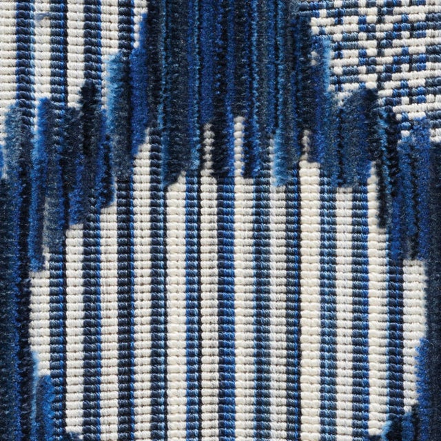 A medley of yarns and a complicated weave structure create the striated effect of this sophisticated dot pattern. Textured...