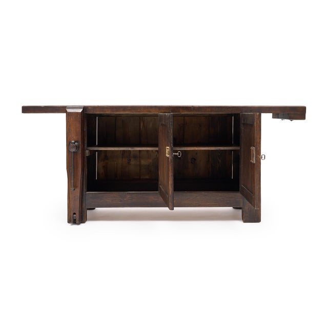 Workbench from the French Alps made of solid wood construction, primarily chestnut. This piece was originally used to...