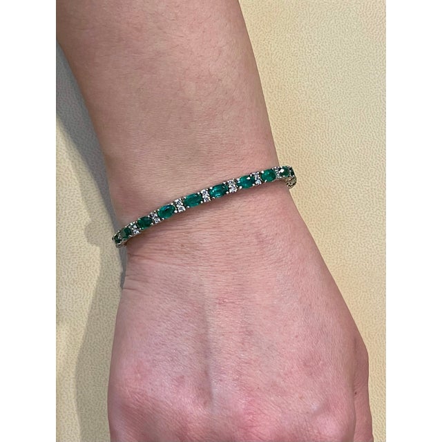 This exceptionally affordable Tennis bracelet has 21 stones of oval Emeralds . Each Emerald is spaced by two diamonds ....