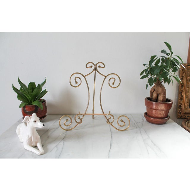 Vintage brass art easel. No makers mark. Some light age wear to brass finish.