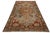 This stunning hand-knotted wool rug showcases a classic Persian design with rust and blue color fields and gray, brown,...