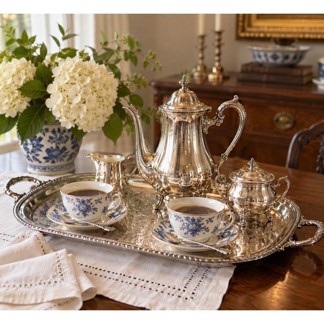 Elegant vintage Wallace silverplate serving tray, featuring an elaborate engraved design of scrolling acanthus leaves,...