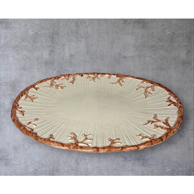 This striking vintage platter from the Fitz & Floyd Oceana collection captures the elegance and whimsy of classic coastal...