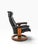 A classic Ekornes Stressless reclining lounge chair with its matching ottoman, in black leather over the early teak-...