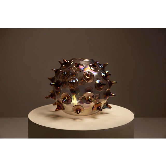 Some objects rely on contrast rather than complexity. The 'Riccio' vase by Gae Aulenti for Venini, designed in 2003,...