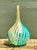 This vintage blown glass vase channels the swirling elegance of Murano-style artistry, its form tapering gracefully from a...