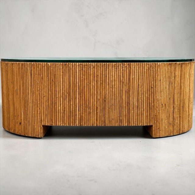 This is a 1970s Italian organic modern pencil bamboo glass top coffee table in the manner of Gabriella Crespi. At 50...
