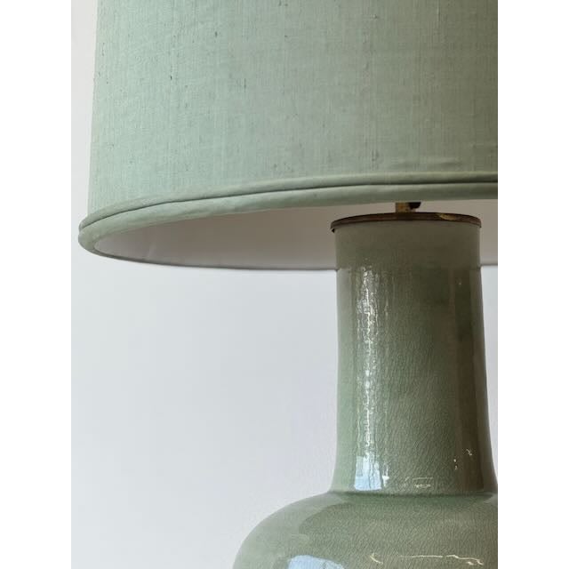 Sage green serenity. ️✨ This mid-century celadon ceramic lamp is a masterclass in 1950s texture and tone. Featuring a...