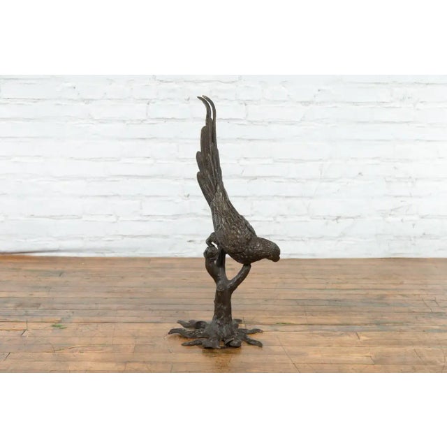 Contemporary Bronze Statue of a Parrot Perched on a Branch and Leaning Down, with Dark Patina For Sale In New York - Image 6 of 13