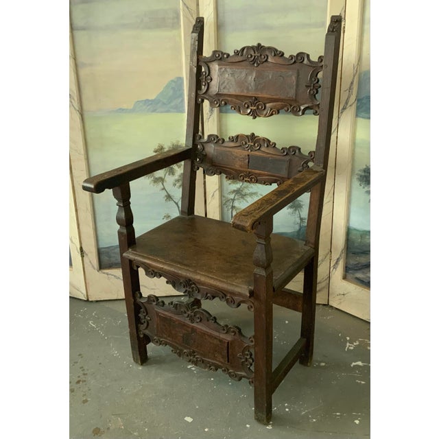 Incredible antique carved walnut 16th-17th century tall armchair. Burl panels on backsplash and front. Similar armchair...