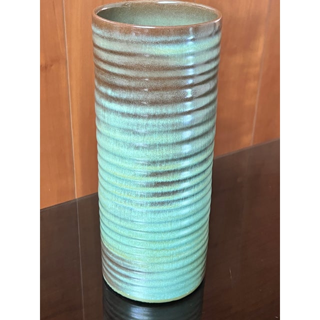 Frankoma #72 Cylinder Vase is often called the "Ringed Tower" vase. The earthy, ribbed mid-century pottery is glazed in...